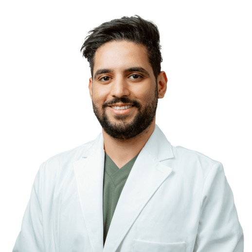Dr Mohammed Shubbar wearing a white clinical coat